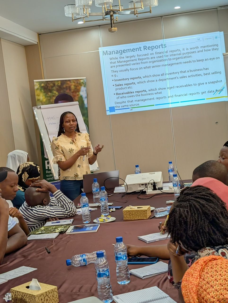 Sarah Maguha presenting financial reports training session